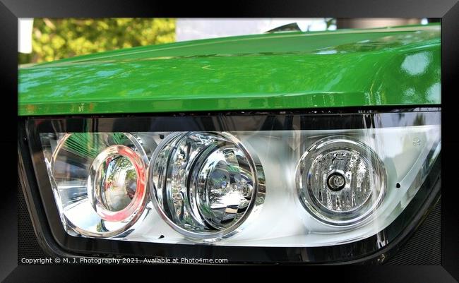 headlight on the front  of John Deere tractor Framed Print by M. J. Photography