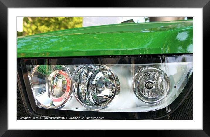 headlight on the front  of John Deere tractor Framed Mounted Print by M. J. Photography