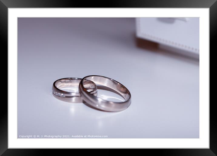 wedding rings isolated on white Framed Mounted Print by M. J. Photography
