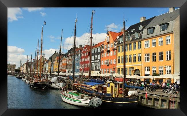 Nyhavn is a 17th-century waterfront, canal and ent Framed Print by M. J. Photography