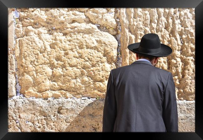Jew in praying at the Wailing Wall in Jerusalem,  Framed Print by M. J. Photography