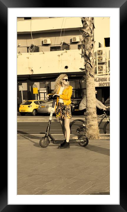 BLonde girl drive scooter Framed Mounted Print by M. J. Photography