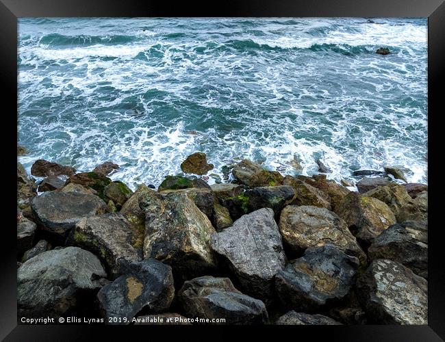 Waves on the Rocks Framed Print by Ellis Lynas