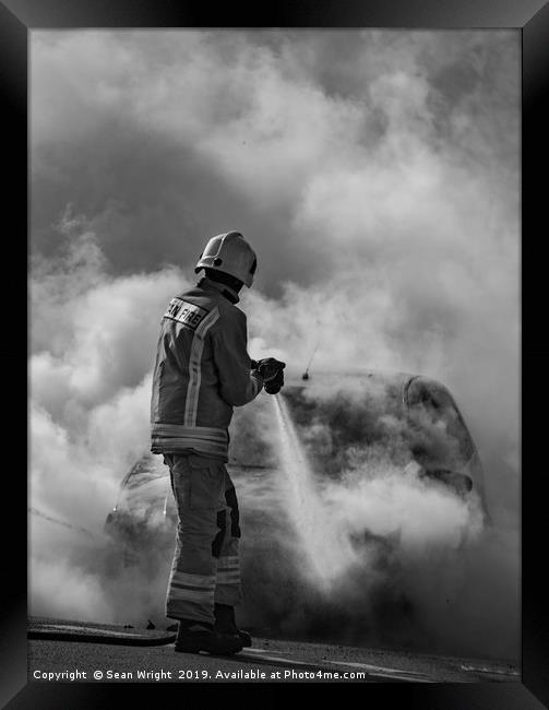 Fireman Tackles a Car Fire Framed Print by Sean Wright