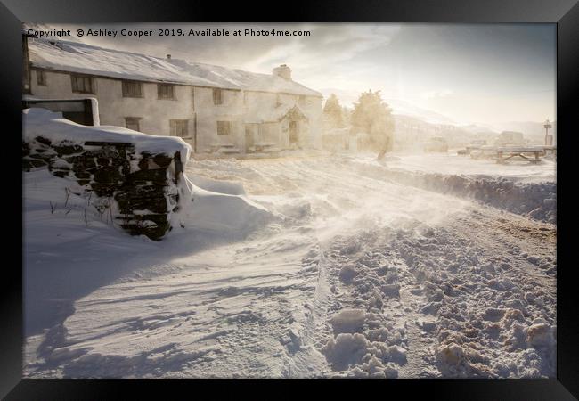 The Kirkstone Pass Inn, plastered in fresh snow  Framed Print by Ashley Cooper