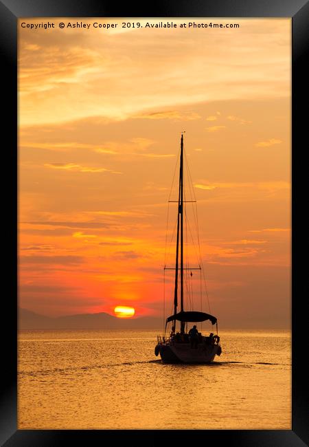 Sailing into sunset. Framed Print by Ashley Cooper