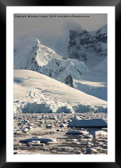 Antarctic spire. Framed Mounted Print by Ashley Cooper