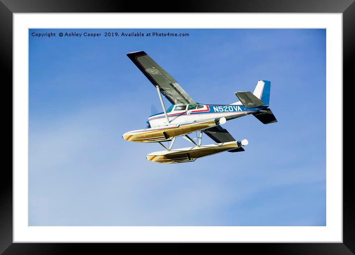 Float plane blue. Framed Mounted Print by Ashley Cooper