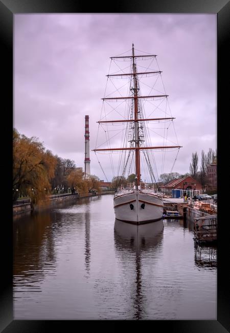 Sailboat at sundown in Klaipeda Framed Print by Jelena Maksimova