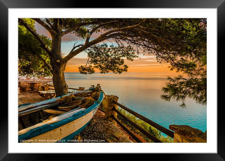 fishing boat watching the sunset Framed Mounted Print by Mario Koufios