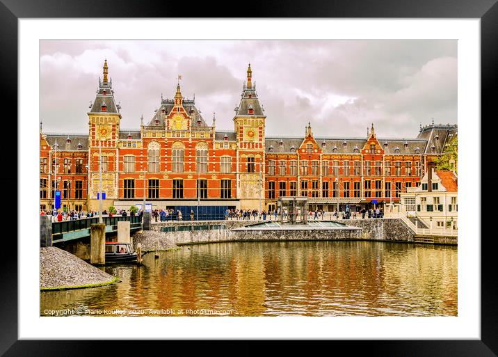 Central train station in the city of Amsterdam. europe netherlands holland Framed Mounted Print by Mario Koufios