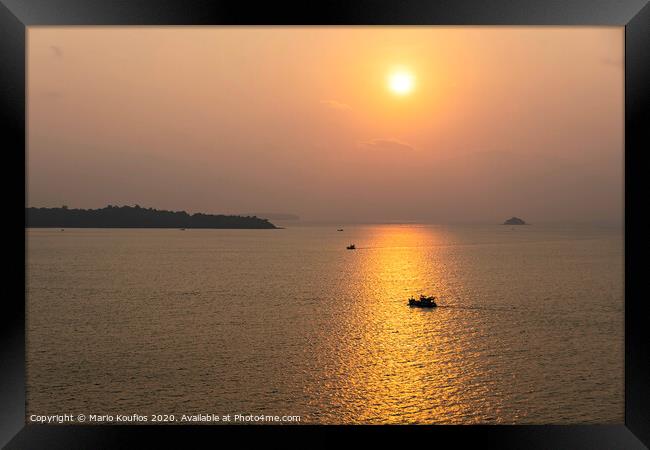 sunset with fishing boats in the vicinity singapore Framed Print by Mario Koufios