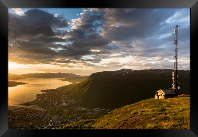 Mountainside above Tromso, Norway midnight sun Framed Print by David Moore