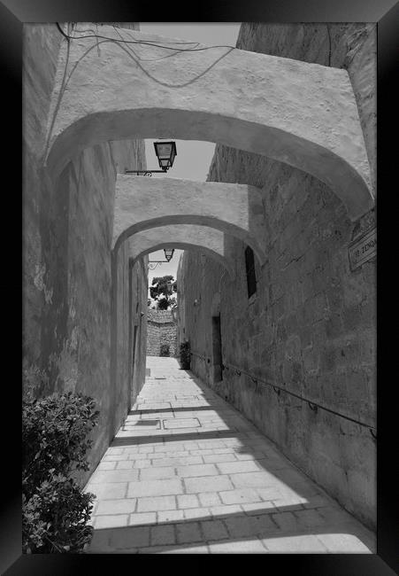 Limestone walled and arched alley Framed Print by Steve Talbot
