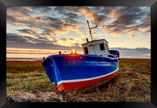 Fishing boat at sunset Framed Print by Ian Homewood