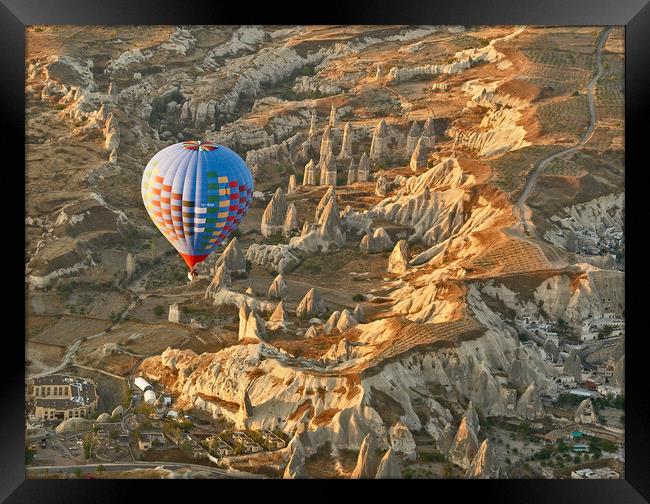 Sunrise Balloon Ascent Over Cappadocia Framed Print by Ian Homewood