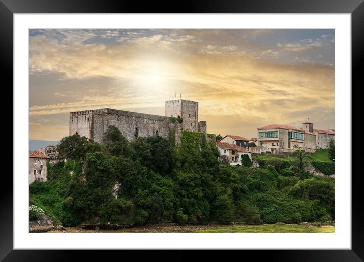 medieval castle in village with sunset sky Framed Mounted Print by David Galindo