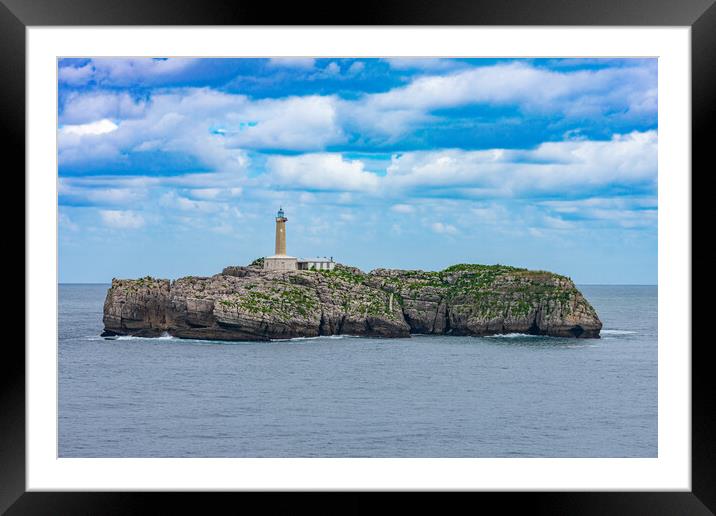 close view of a rock islet in the sea with a lighthouse Framed Mounted Print by David Galindo