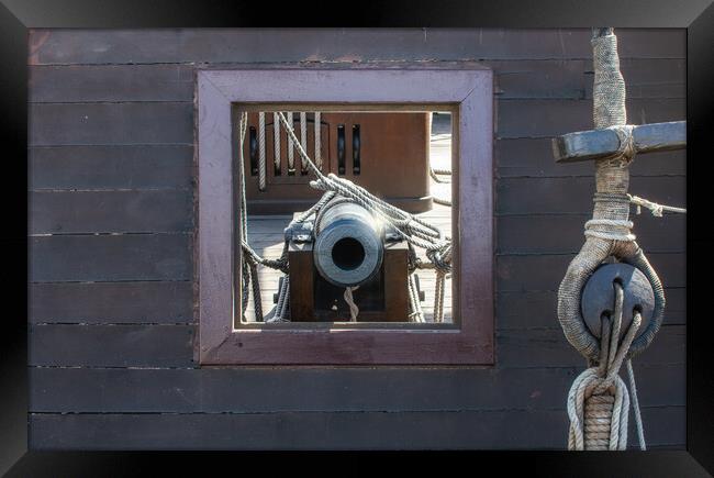 frontal view of cannon in its porthole Spanish galleon Framed Print by David Galindo