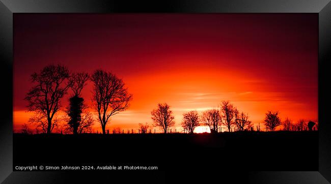 A tree with a sunset in the background Framed Print by Simon Johnson