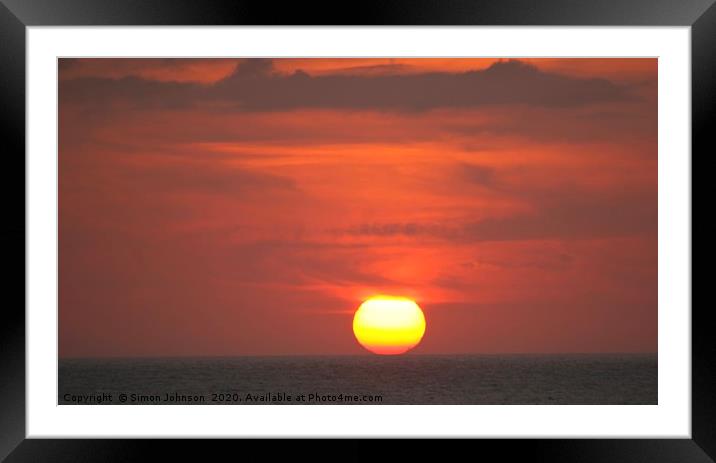 Sun resting on sea Framed Mounted Print by Simon Johnson
