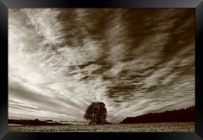 Trees, clouds and sky Framed Print by Simon Johnson