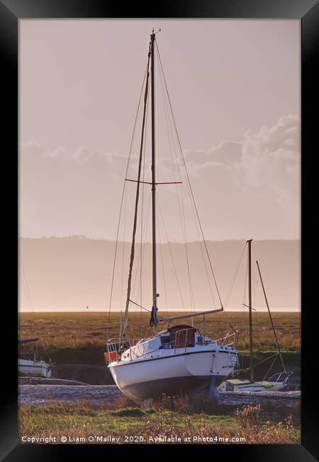 Boat moored at Parkgate Wirral at dusk Framed Print by Liam Neon
