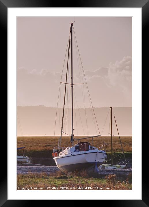 Boat moored at Parkgate Wirral at dusk Framed Mounted Print by Liam Neon