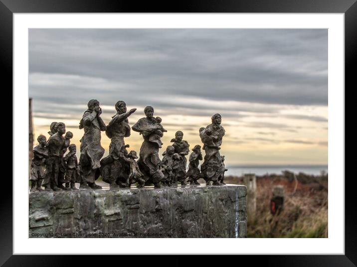 A memorial of families looking out to sea for lost Framed Mounted Print by Liam Thompson