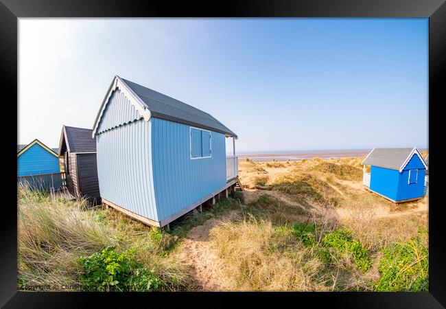 Coastal beach huts on the North Norfolk coast Framed Print by Chris Yaxley