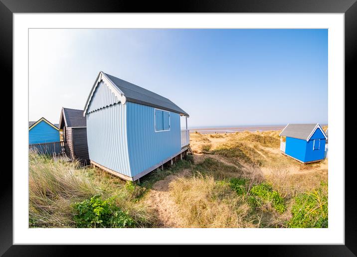 Coastal beach huts on the North Norfolk coast Framed Mounted Print by Chris Yaxley