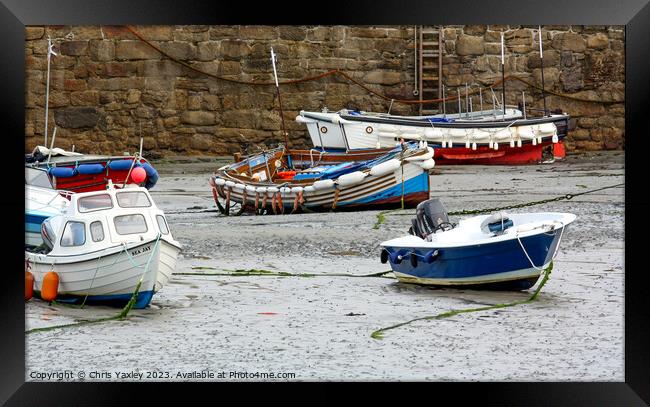 Fishing boats in Padstow Harbour at low tide Framed Print by Chris Yaxley