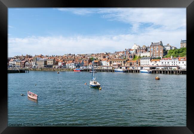 View across the River Esk and Whitby harbour on the North Yorkshire coast Framed Print by Chris Yaxley
