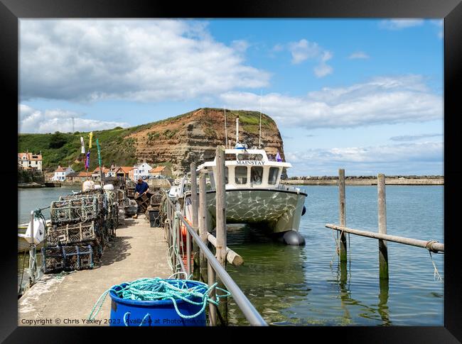 Fishing boat in Staithes harbour Framed Print by Chris Yaxley