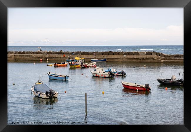 Fishing boats in Staithes Harbour Framed Print by Chris Yaxley