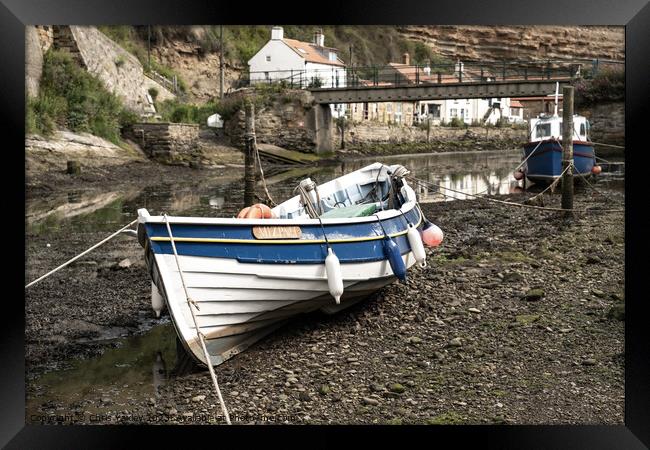 Fishing boat in the seaside village of Staithes Framed Print by Chris Yaxley