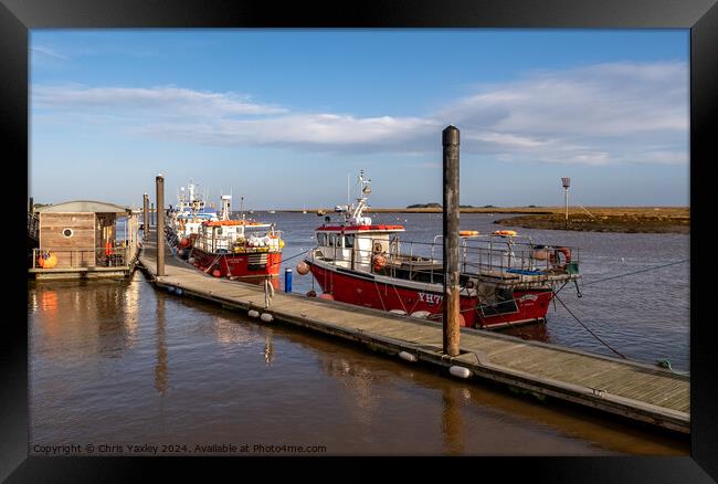 Fishing boats in Wells-next-the-sea harbour Framed Print by Chris Yaxley