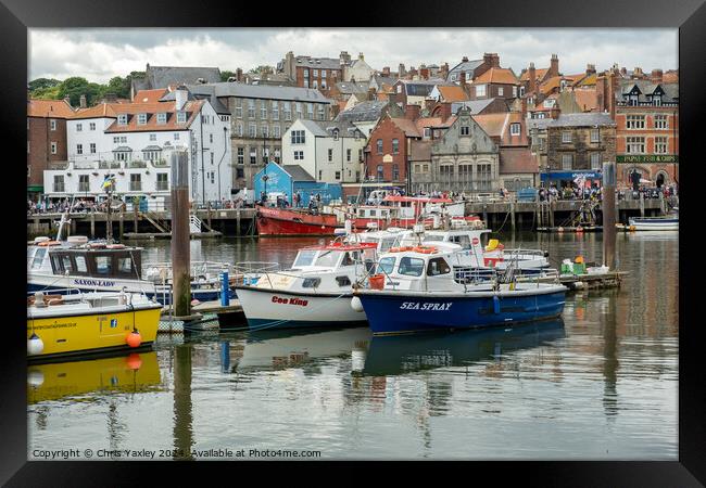 Fishing boats in Whitby harbour Framed Print by Chris Yaxley