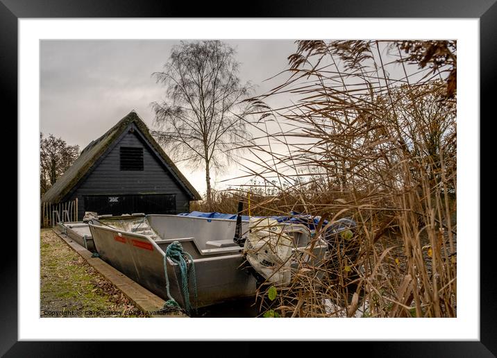 Boats outside the boat shed at How Hill staithe, Norfolk Broads Framed Mounted Print by Chris Yaxley