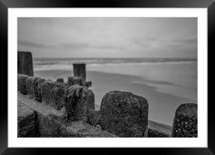 Behind the wooden breakers Framed Mounted Print by Chris Yaxley