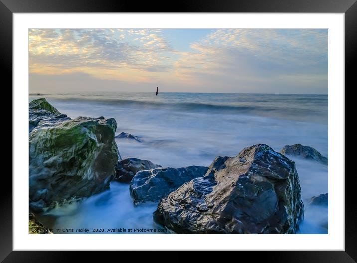 Rocks protecting the fragile cliffs  Framed Mounted Print by Chris Yaxley