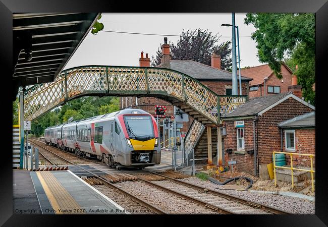 Commuter train in Brundall Gardens station Framed Print by Chris Yaxley