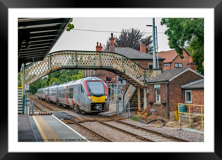 Commuter train in Brundall Gardens station Framed Mounted Print by Chris Yaxley
