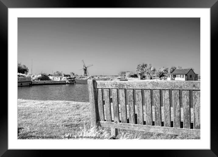 Wooden bench on the bank of the River Thurne Framed Mounted Print by Chris Yaxley