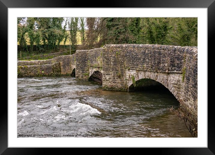 Sheepwash Bridge over a raging River Wye in Ashford in the Water, Derbyshire Framed Mounted Print by Chris Yaxley
