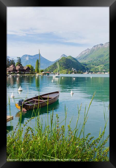 Wooden boat on the lake of Annecy Framed Print by Laurent Renault