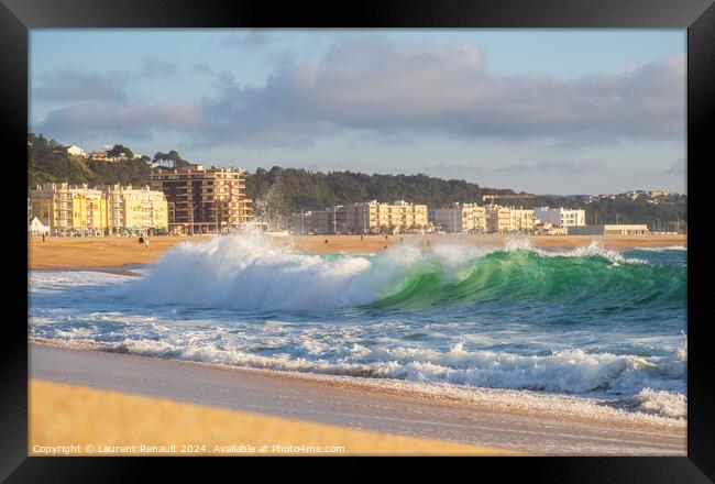 Big wave in Atlantic Ocean on the beach in Nazaré, Portugal Framed Print by Laurent Renault