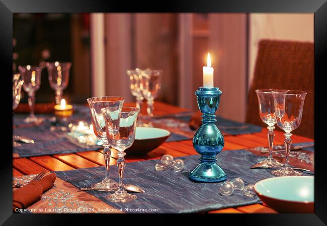 Dining table setting with glasses, decorations and candles Framed Print by Laurent Renault