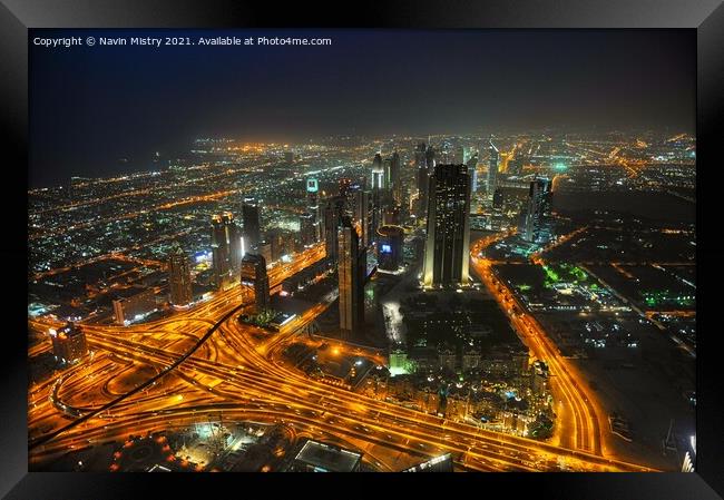 A night time view over Dubai, UAE, seen from the Burj Khalifa Framed Print by Navin Mistry