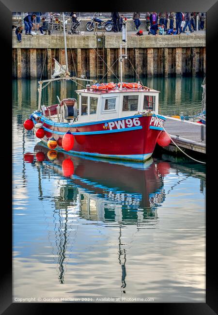 A fishing boat moored in Padstow Harbour  Framed Print by Gordon Maclaren